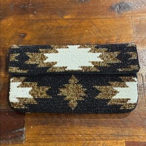 From St Xavier aztec beaded evening clutch